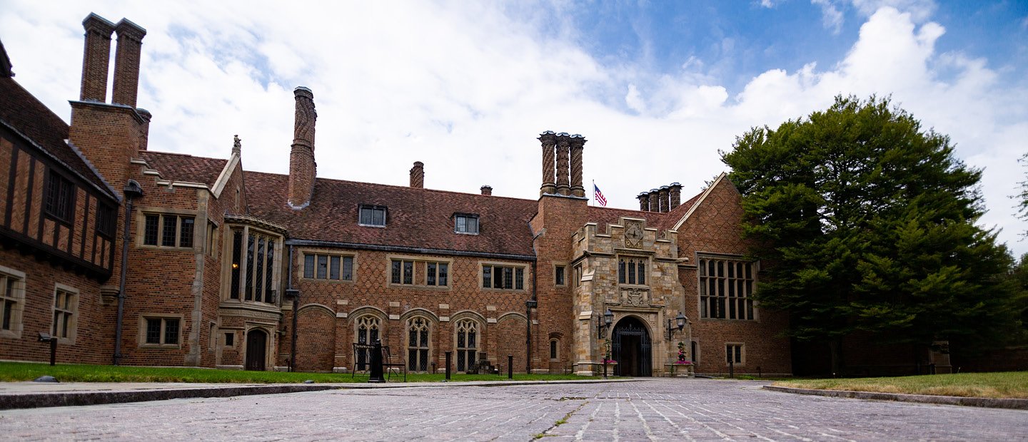 Meadow Brook Hall building Photo of Meadow Brook Hall, a large historic brown brick building.