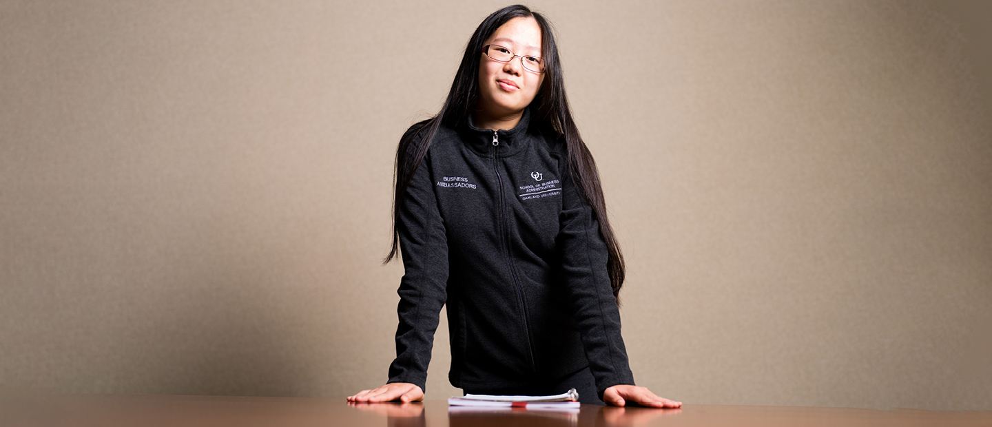 Digital Marketing Banner A student standing with their arms crossed