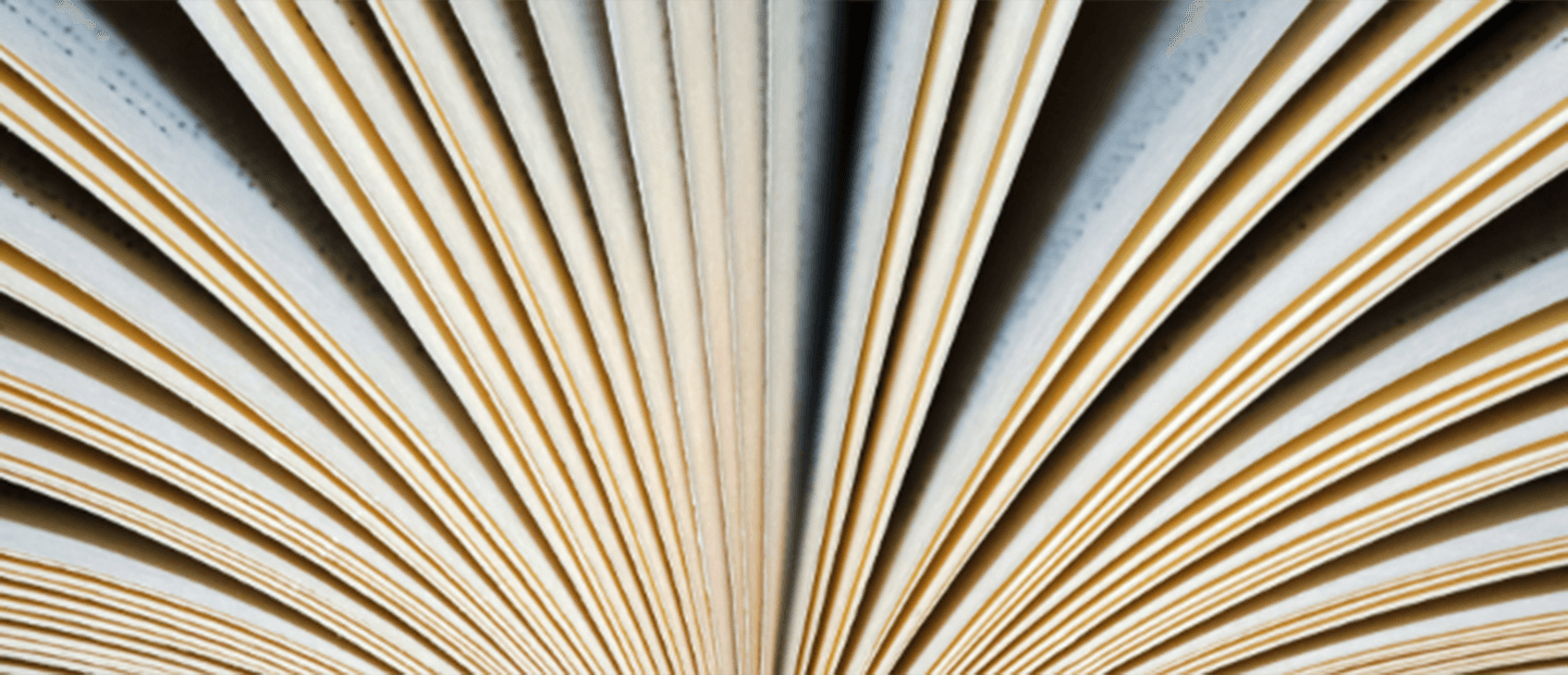 Research Publications Banner A book resting on its spine with the pages fanned out.