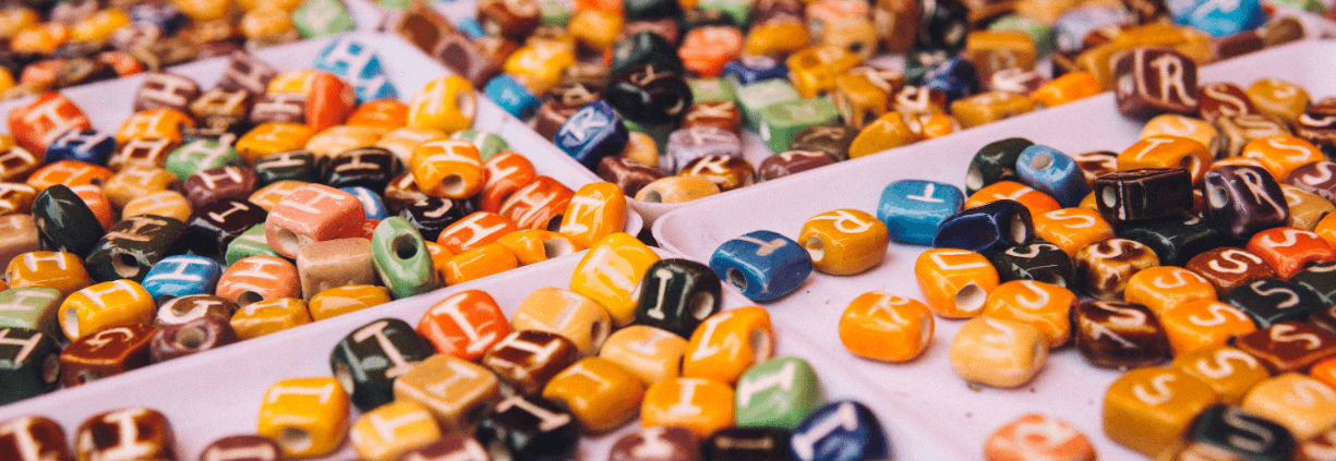 Letter jewelry beats sorted into compartments
