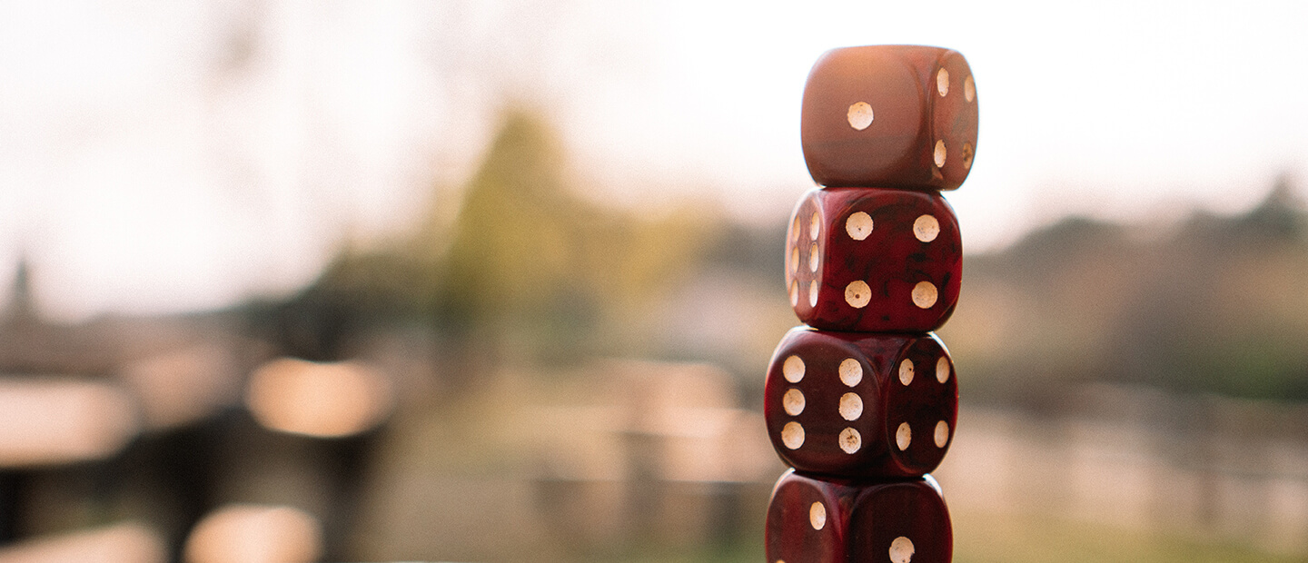 Four dice stacked on top of each other