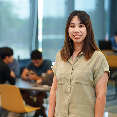 An ESL student smiling at the camera