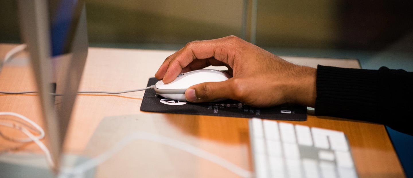 Activate Banner Closeup of a hand using a computer mouse