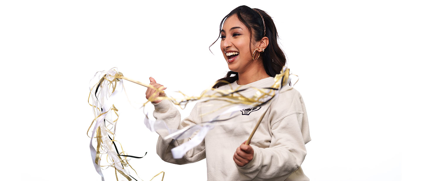 Student Leader Recruitment Banner Young woman with long dark hair holding ribbon wands and smiling.