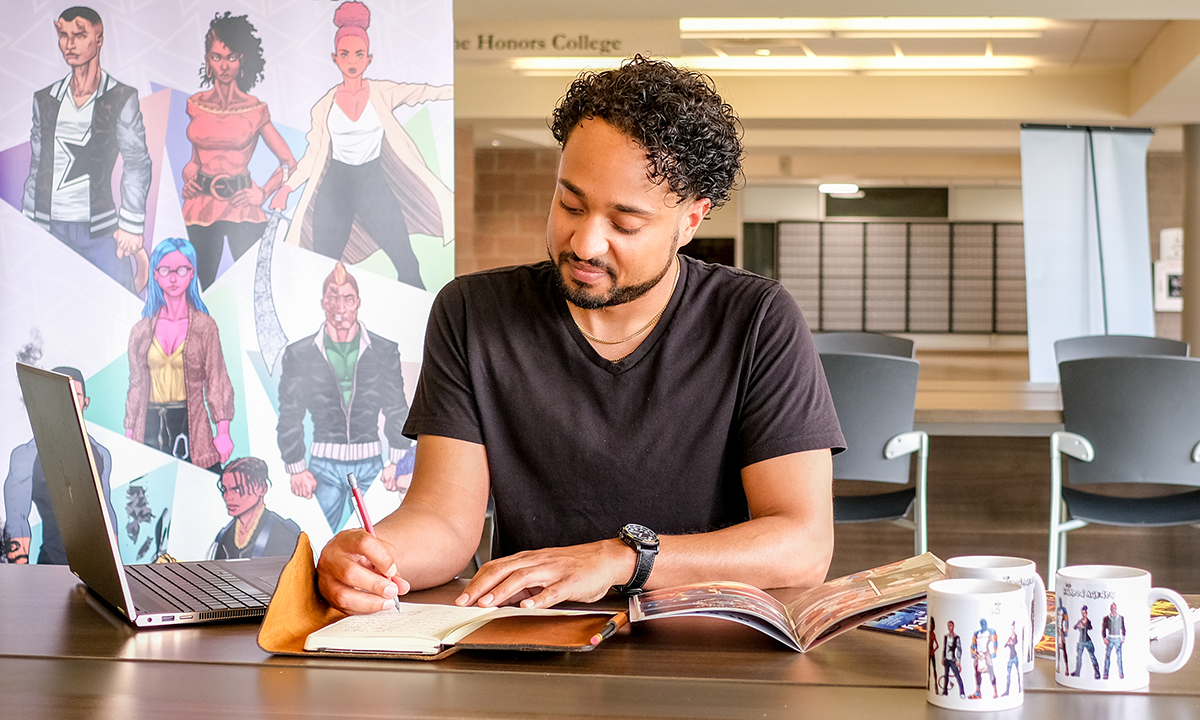 A person working on a comic book