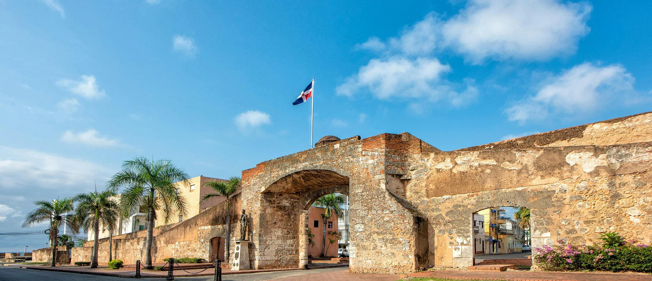 Exploring Grief, Death and Dying in the Dominican Republic An archway and wall in Santo Domingo