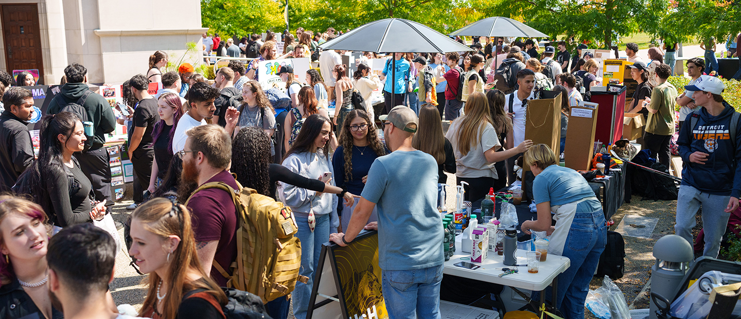 A busy student life event outdoors at Oakland University