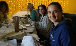 Students at a table during a day of service event