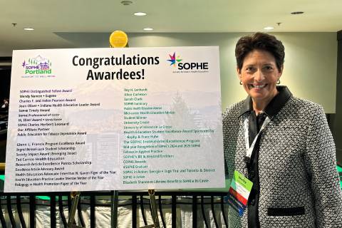 Provost Amy Thompson at SOPHE 2026 Annual Conference in front of sign
