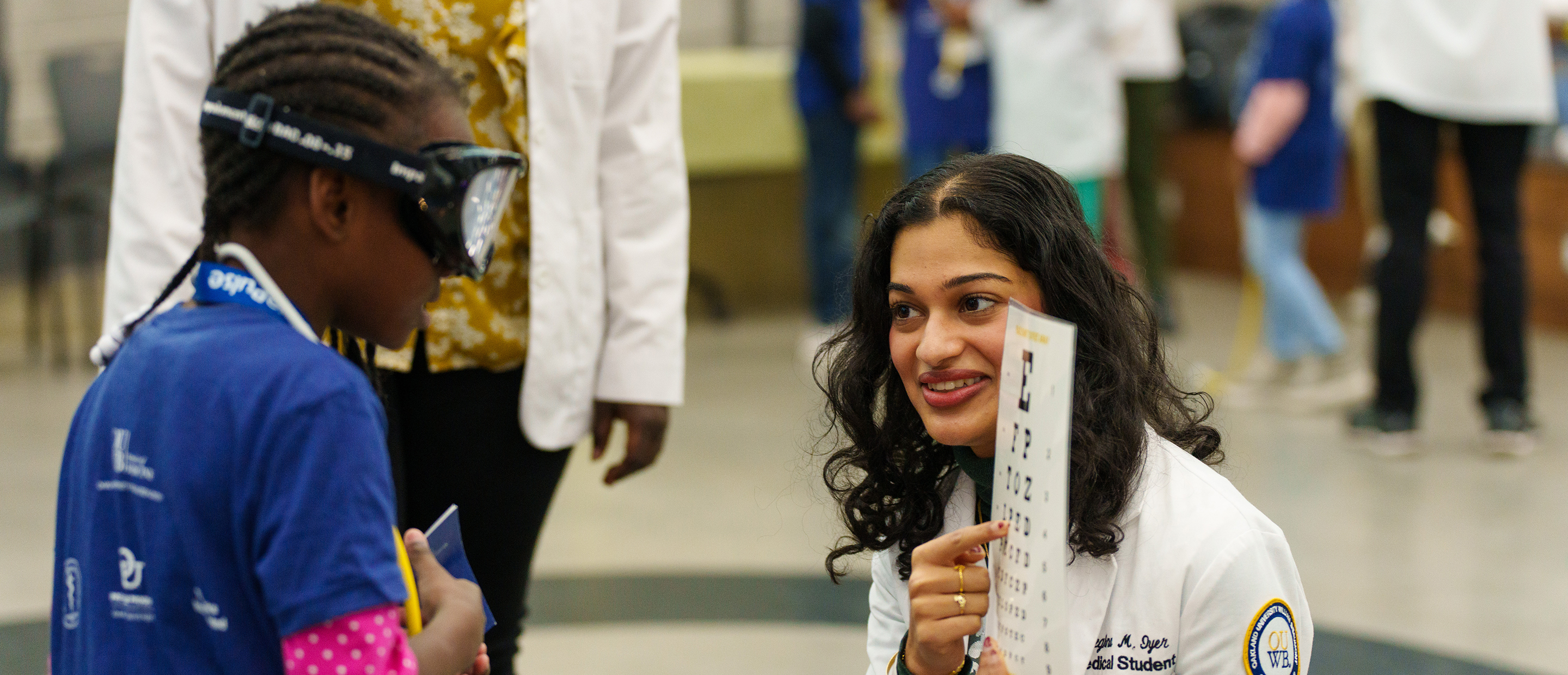 OUWB Compass Banner An image of a medical student and patient