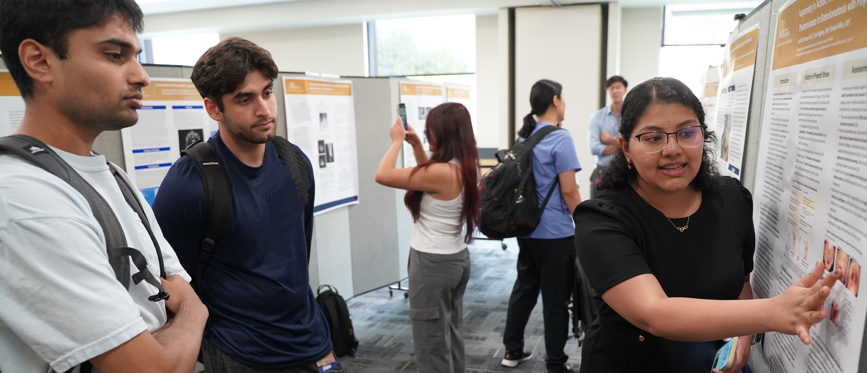 Research Resources Banner An image of a student presenting a poster
