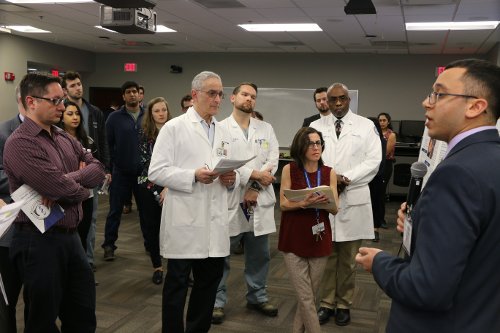 An image of people listening to a presentation