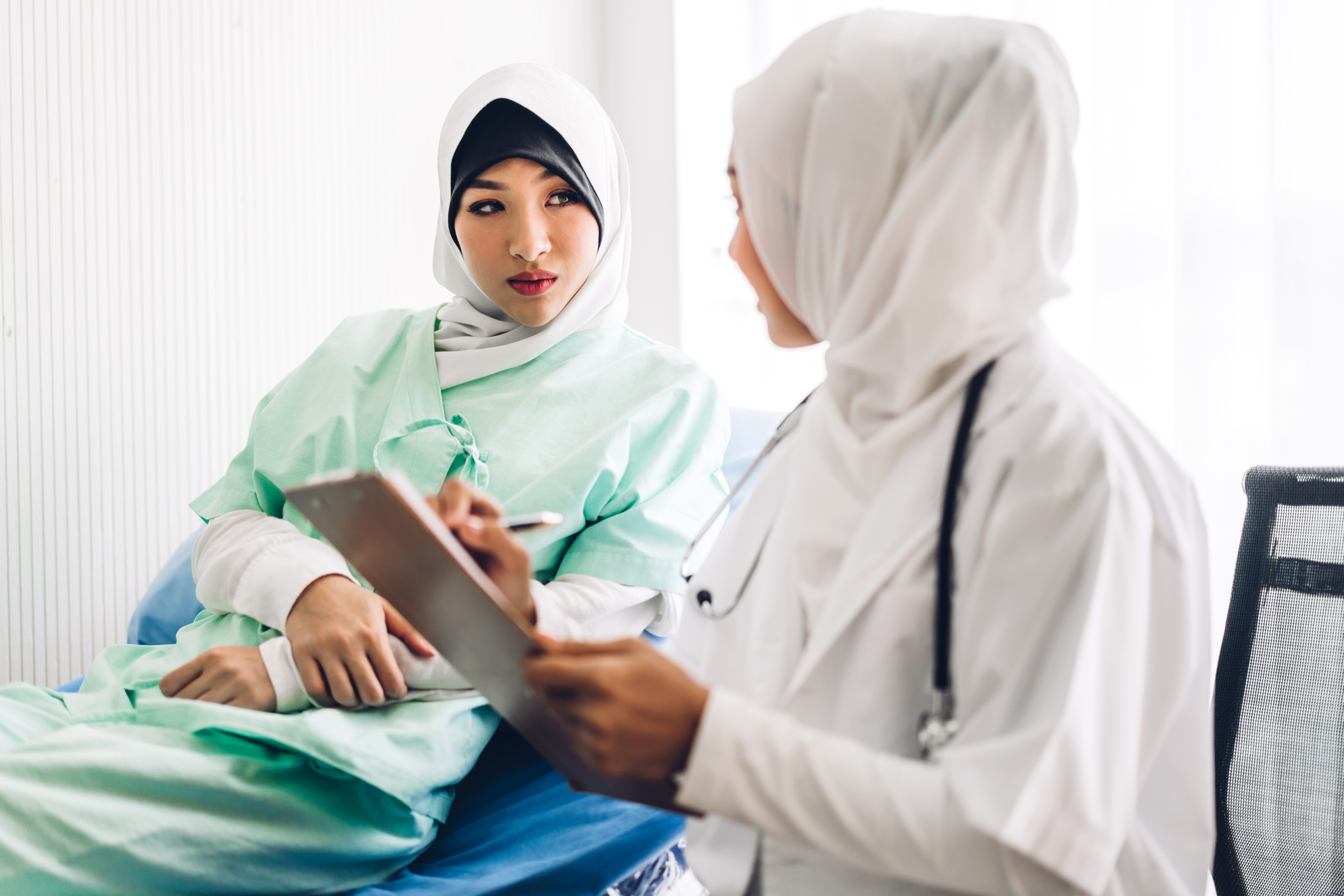An image of a patient and doctor