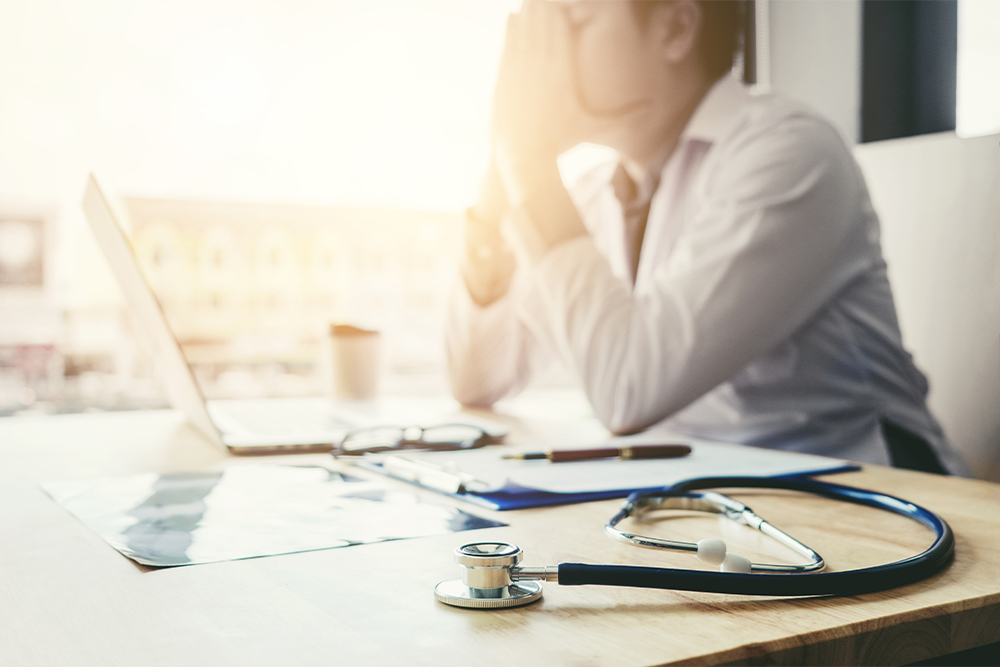 An image of a doctor who is stressed