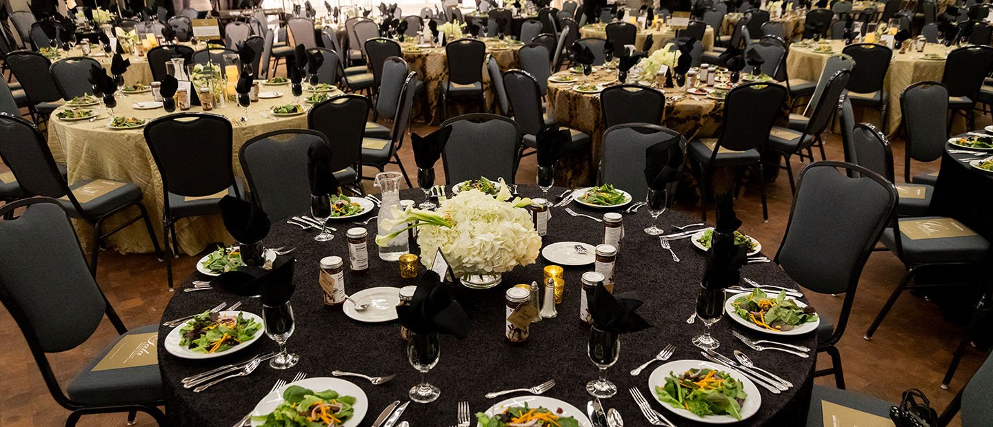 Types Banner empty banquet room with salads at place settings