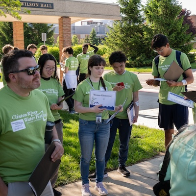 A group of volunteers in green shirts