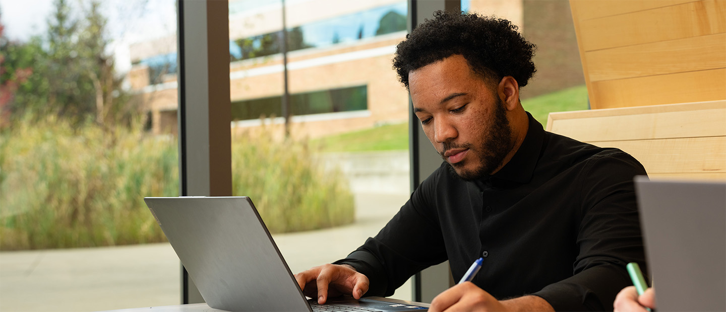 A man working at a laptop