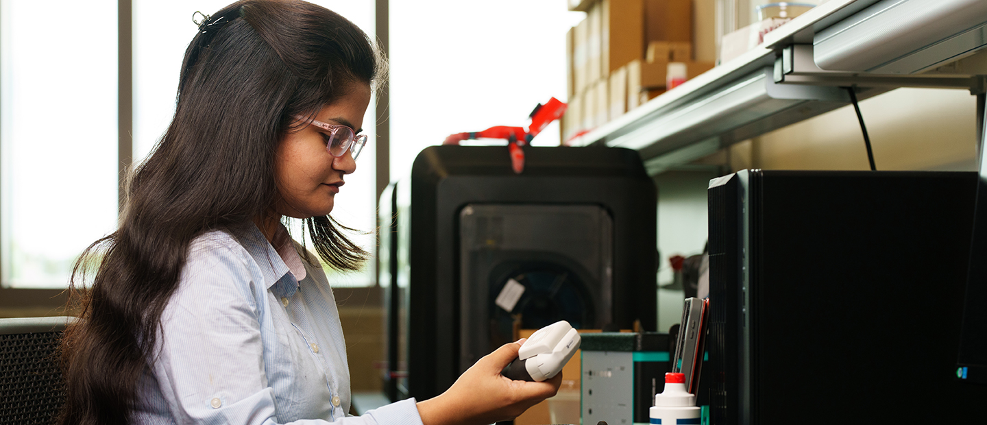 SEC Master of Science programs ECE Banner A young woman working with electrical equipment