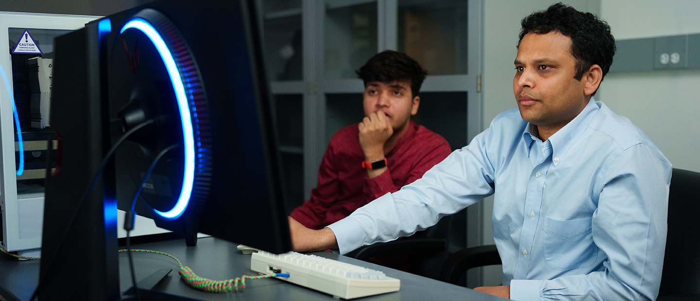 Undergraduate Programs Data Science Two men working at a computer