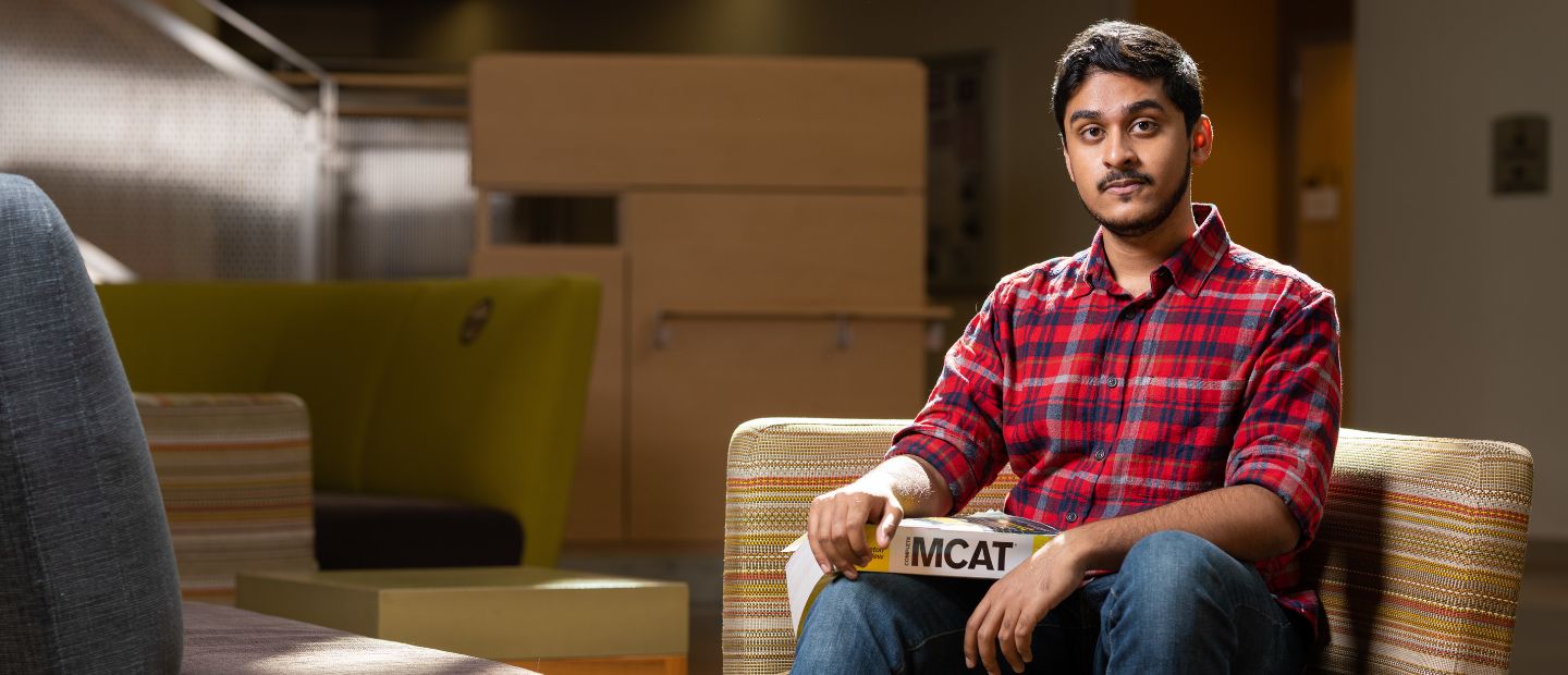 health sciences student A man sitting in a chair, looking at the camera.