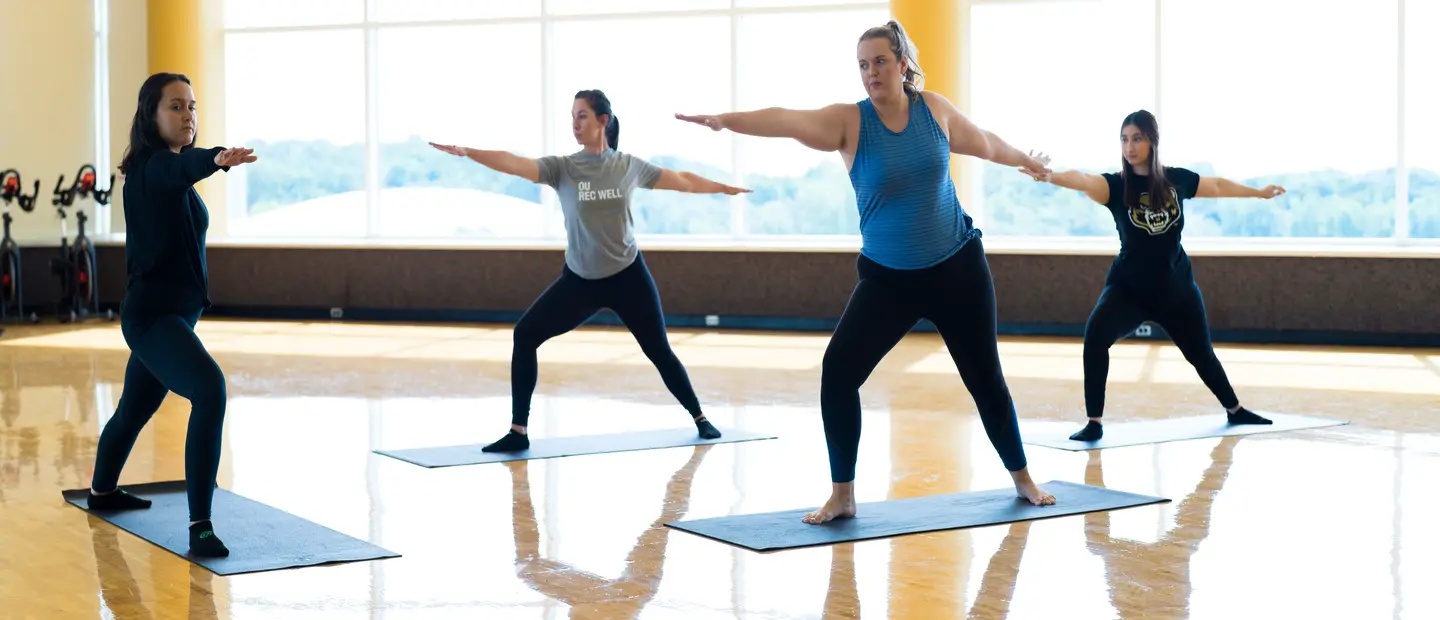 IDH Minors Students taking a yoga class in a studio
