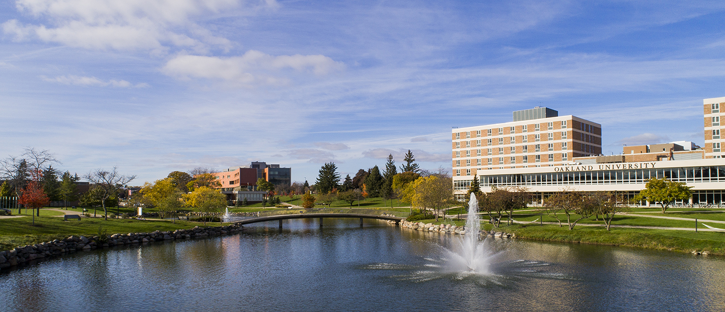 OU Campus image of Oakland University's campus with a view of Bear Lake, Vandenberg Hall and the Human Health Building