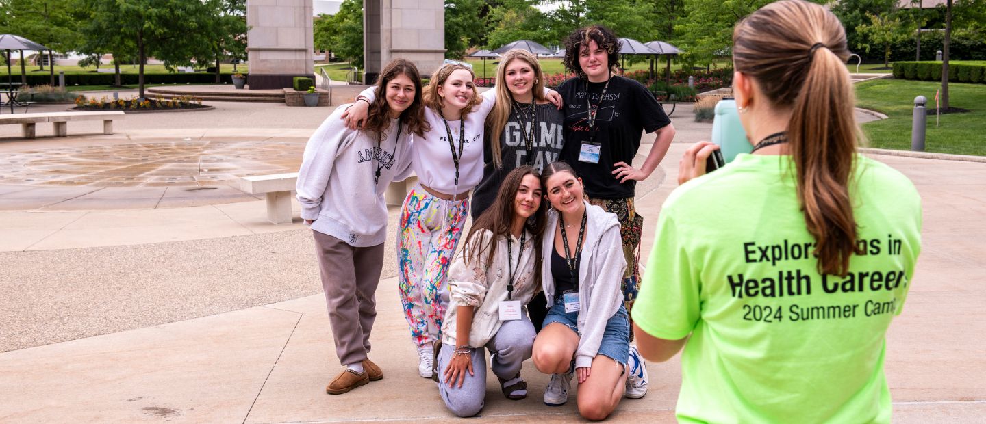 Health Science Summer Camps Young students taking a photo with a group leader