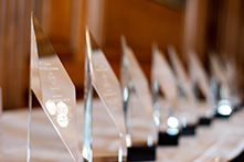Row of trophies on a table
