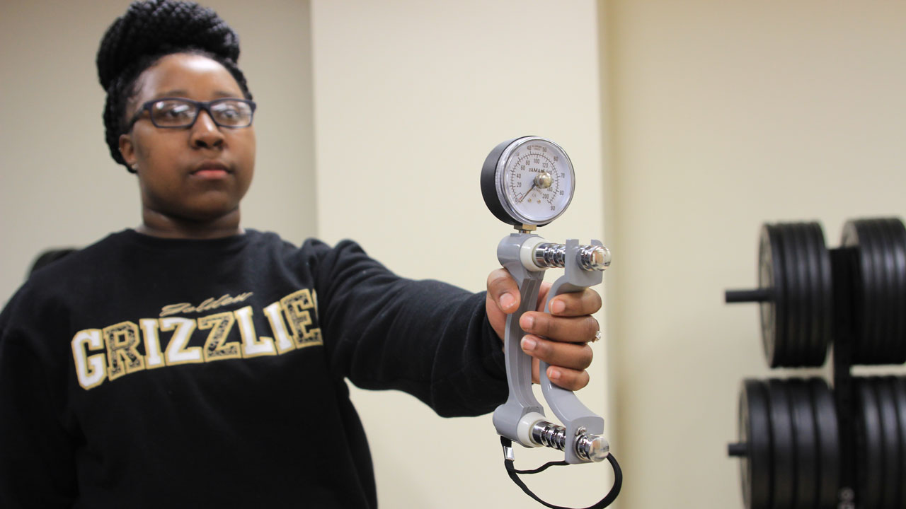 Artishia Moore with dynamometer