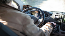 A stock image of a person driving a car.