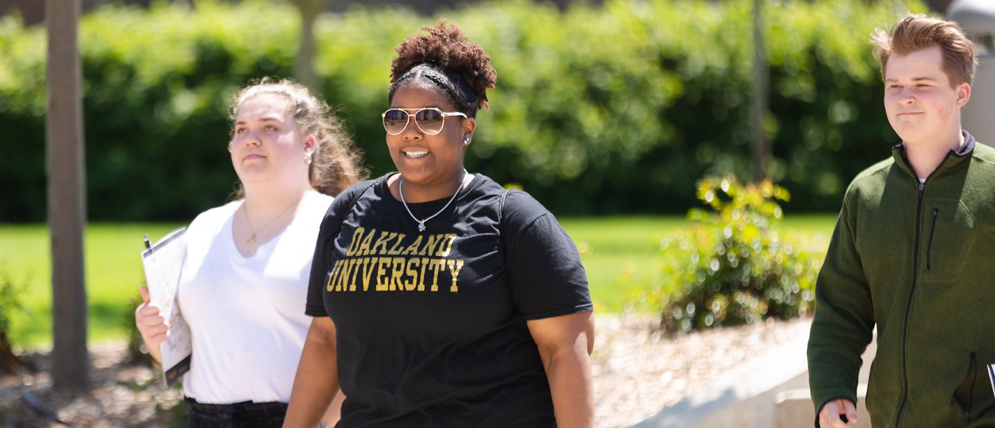 Current OU Students Banner Students walking on Oakland University's campus in Summer.