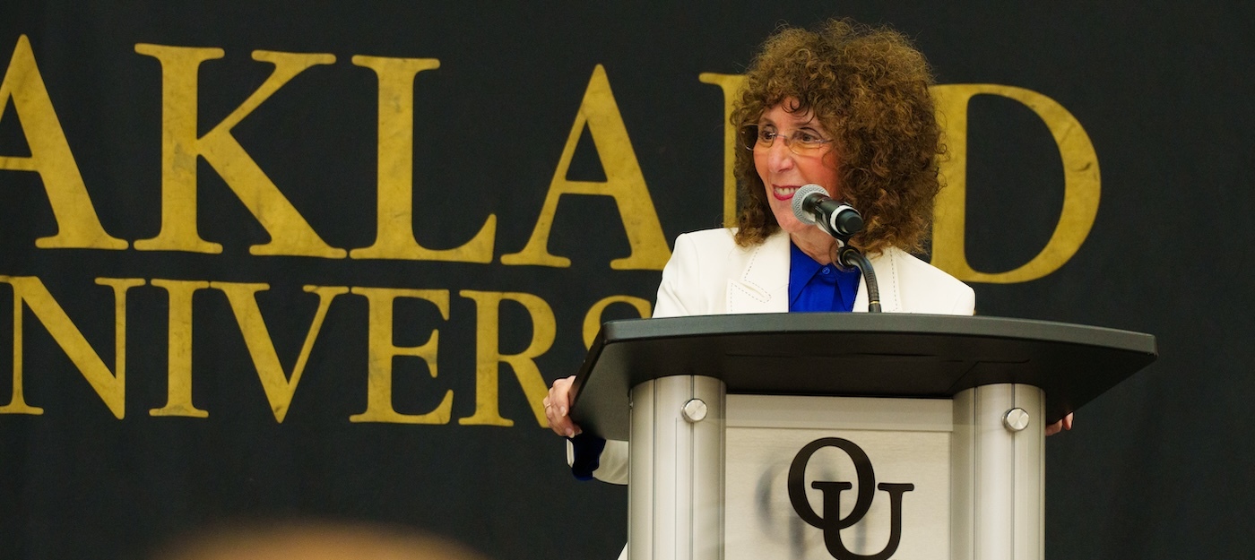 Ora Hirsch Pescovitz speaking at a podium