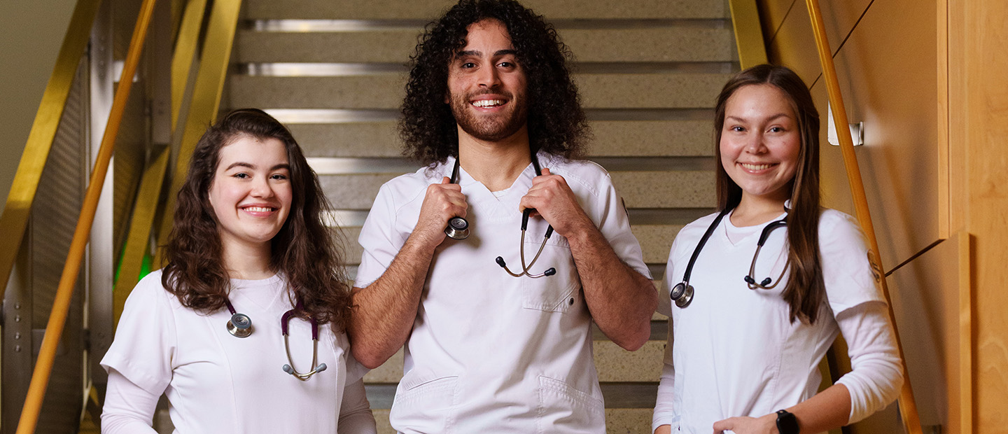 SON-25447_095 bsn undergrad.jpg students wearing white lab coats