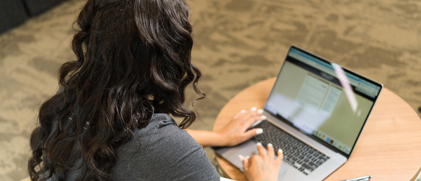 Prepare for Transfer Student Orientation A woman using an Oakland University website on a laptop